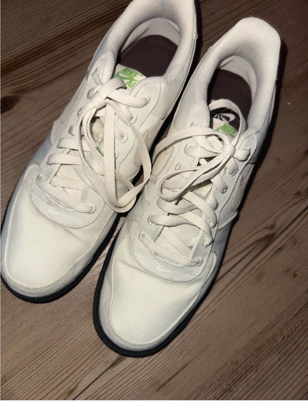 Nike Cream Canvas Sneakers with Black Soles and Green Logo